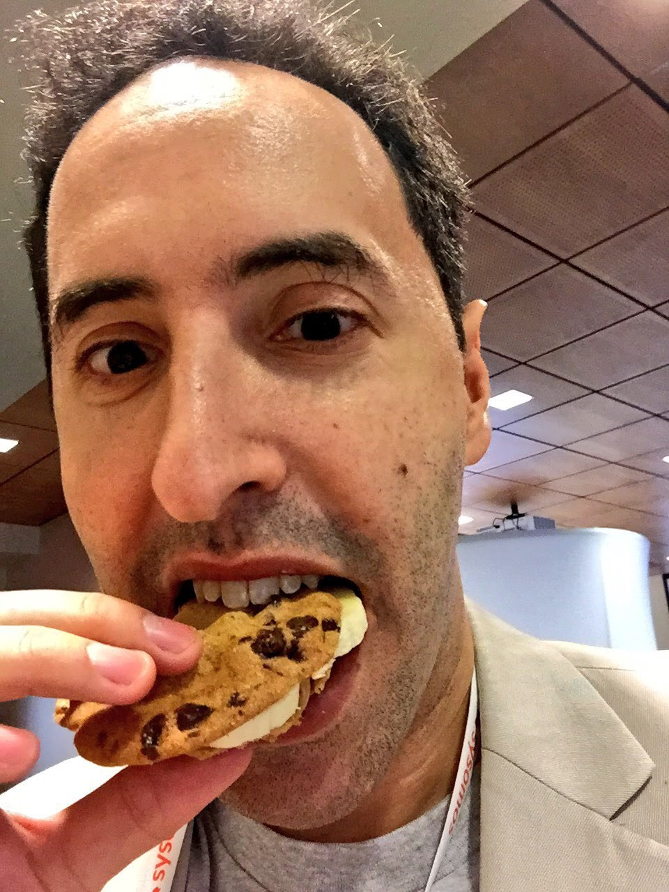The founder enjoying a chocolate chip cookie ice cream sandwich